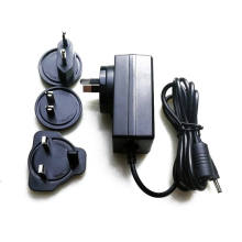 Interchangeable Plug Adapter EU/Us/UK/Au/Cn Standard 9V 2A Power Supply